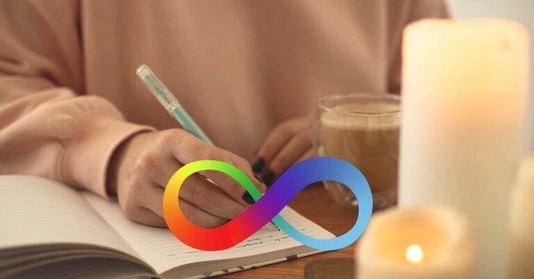 A woman is writing in a journal at a desk with lit candles and a mug of coffee. The rainbow autism symbol is overlaid on the image to represent that she is processing her diagnosis. Late-identified autism.