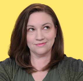 Photo of Heather Tinker, creator of howtobeneurodivergent.com, with a playful eyerolling expression.